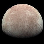 The Jupiter moon Europa captured by the Juno spacecraft during a flyby in 2022. Oceans of water slosh beneath Europa’s surface under a shell of ice that could be more than 10 miles thick.