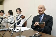 Toshiyuki Mimaki, right, president of Nihon Hidankyo, at a news conference in Hiroshima, Japan, on Friday, after the group was awarded the Nobel Peace Prize.