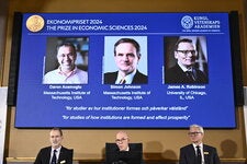 Members of the Swedish Academy of Sciences announcing the 2024 Nobel Memorial Prize in Economic Sciences in Stockholm on Monday.