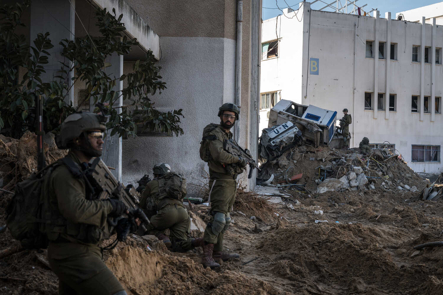 Israeli soldiers during a military tour for journalists of a tunnel under a U.N. site in Gaza. The Times later found that a Palestinian had been forced to explore the tunnel.